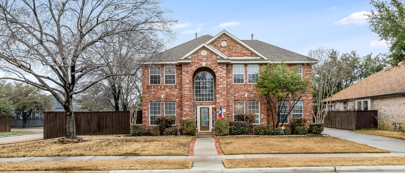 Brick home with well-maintained front yard