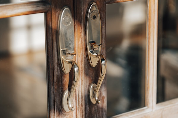 Close-up of modern door handle hardware on wooden door